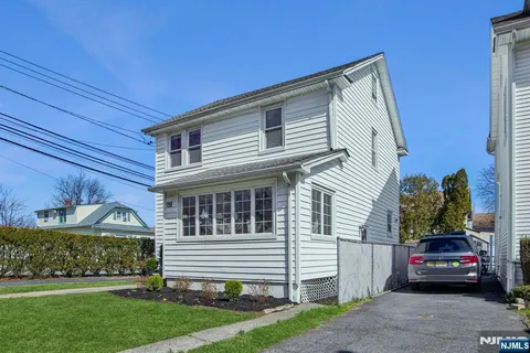 a view of a house with a small garden