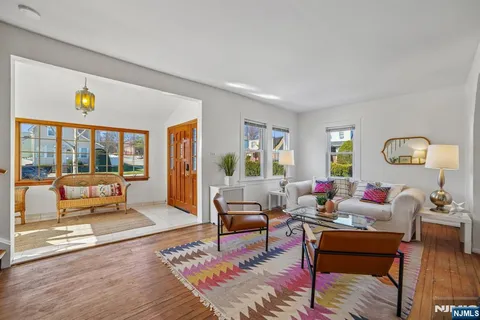 a living room with furniture and a table