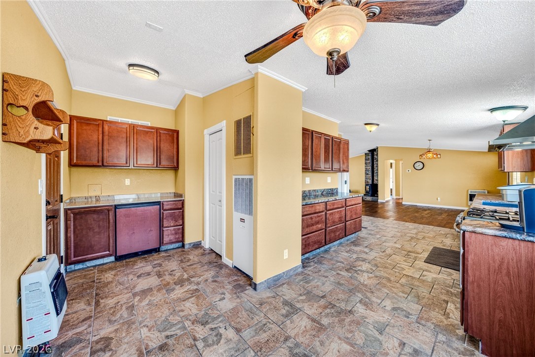 1831 West Horn Road Pahrump, NV 89048 - Photo 6 of 59 A well-equipped kitchen space featuring durable tile flooring and abundant cabinetry, ready for culinary endeavors.