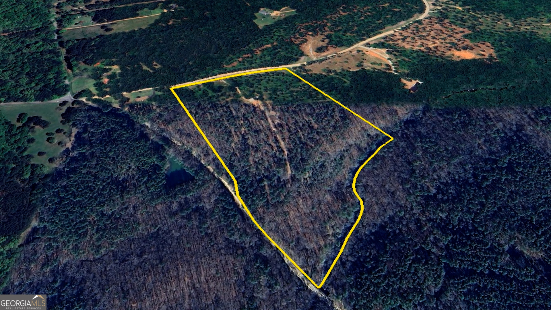 940 Newton Factory Bridge Road Covington, GA 30014 - Photo 4 of 58 a view of water heater and wooden fence