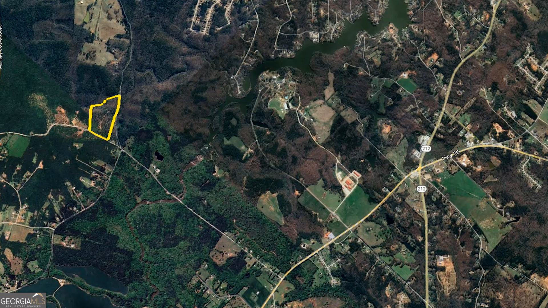 940 Newton Factory Bridge Road Covington, GA 30014 - Photo 58 of 58 a backyard of a house with a yard and outdoor seating