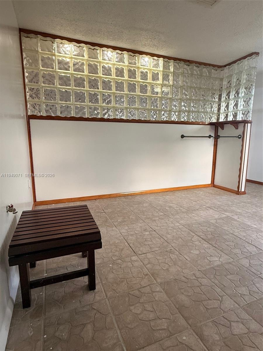 3709 Grand Concourse Sebring, FL 33875 - Photo 18 of 74 a wooden bench sitting in a room