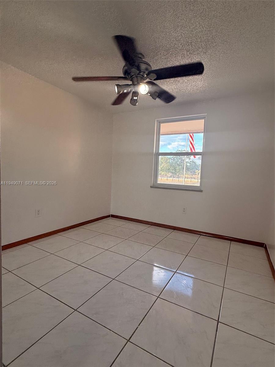3709 Grand Concourse Sebring, FL 33875 - Photo 29 of 74 a view of an empty room with a window
