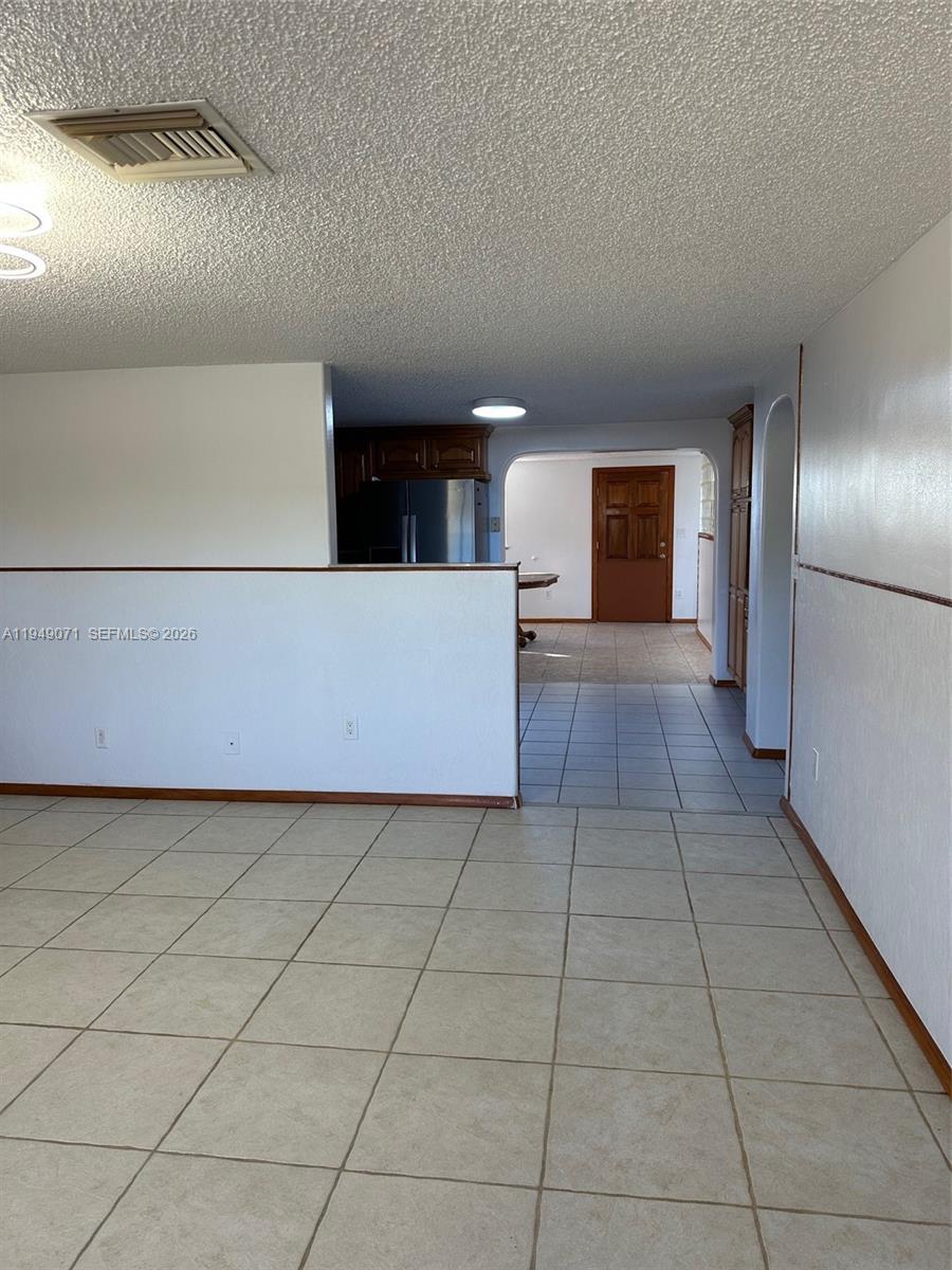 3709 Grand Concourse Sebring, FL 33875 - Photo 10 of 74 a view of a kitchen with an empty space and a sink