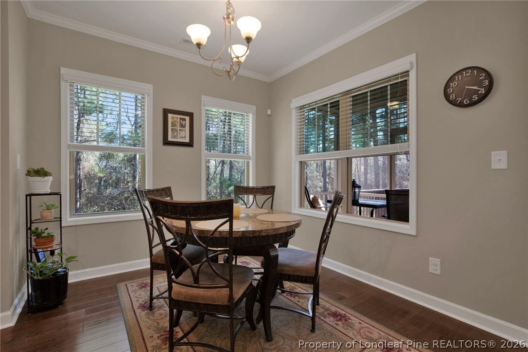 207 Pinetop Drive Carthage, NC 28327 - Photo 12 of 50 a view of a dining room with furniture window and wooden floor