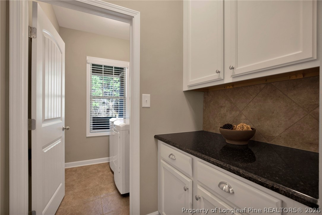 207 Pinetop Drive Carthage, NC 28327 - Photo 19 of 50 a kitchen with white cabinets and sink