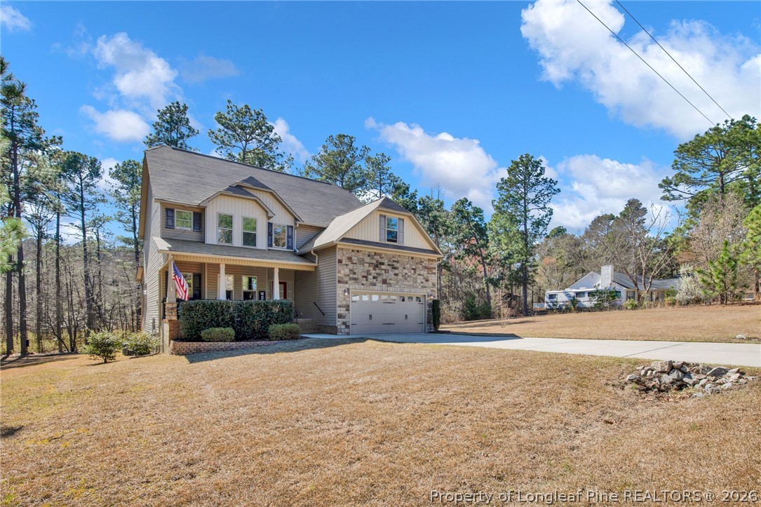 207 Pinetop Drive Carthage, NC 28327 - Photo 2 of 50 a front view of house with yard and trees around