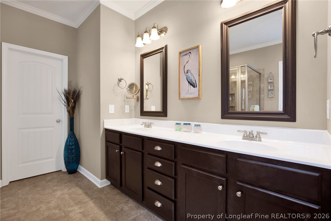 207 Pinetop Drive Carthage, NC 28327 - Photo 24 of 50 a bathroom with a double vanity sink and a mirror