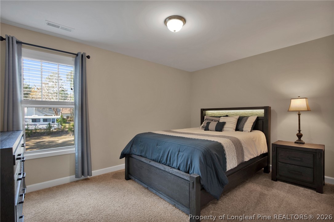 207 Pinetop Drive Carthage, NC 28327 - Photo 27 of 50 a spacious bedroom with a bed and a window