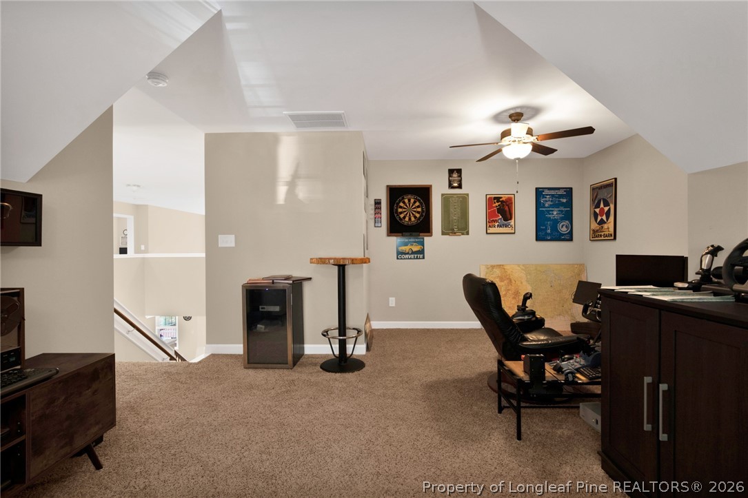 207 Pinetop Drive Carthage, NC 28327 - Photo 36 of 50 a living room with furniture a flat screen tv and a window