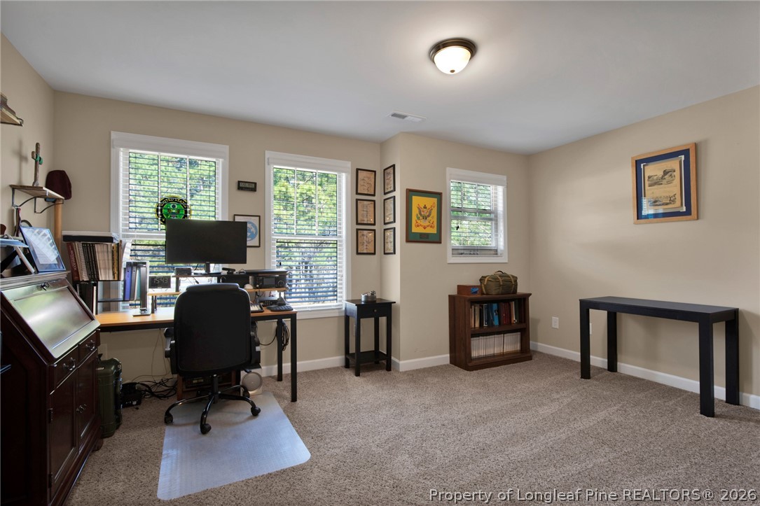 207 Pinetop Drive Carthage, NC 28327 - Photo 38 of 50 a view of a livingroom with workspace and a window