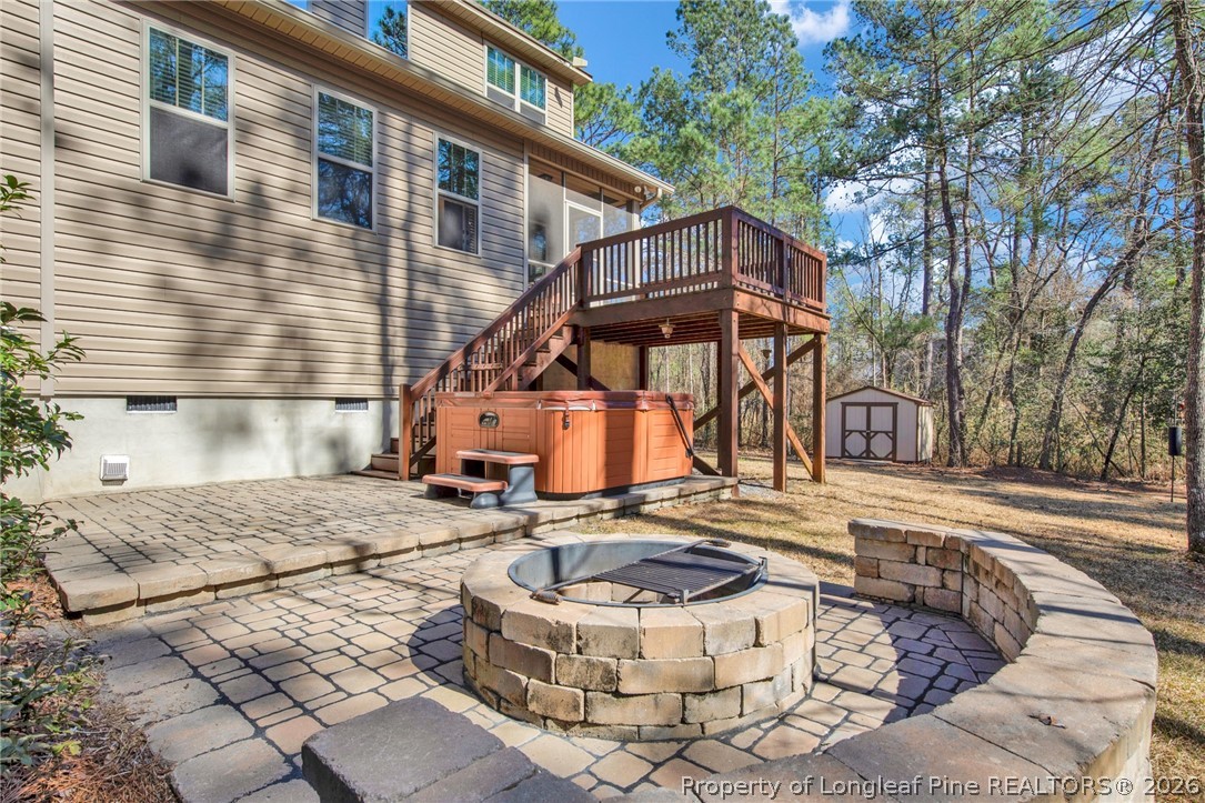 207 Pinetop Drive Carthage, NC 28327 - Photo 42 of 50 a view of a house with a chairs in a patio