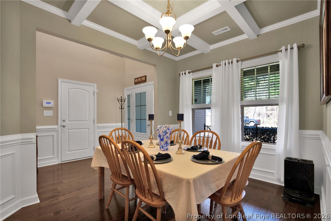 207 Pinetop Drive Carthage, NC 28327 - Photo 7 of 50 a view of a dining room with furniture a chandelier and wooden floor