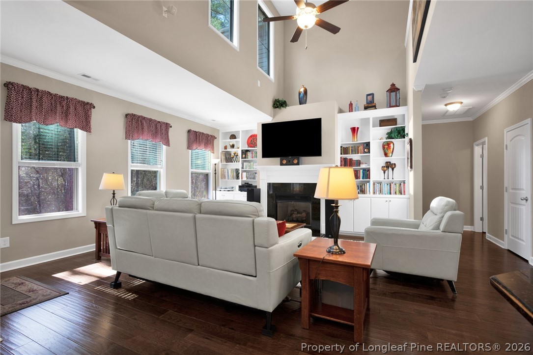 207 Pinetop Drive Carthage, NC 28327 - Photo 8 of 50 a living room with furniture a flat screen tv and a fireplace