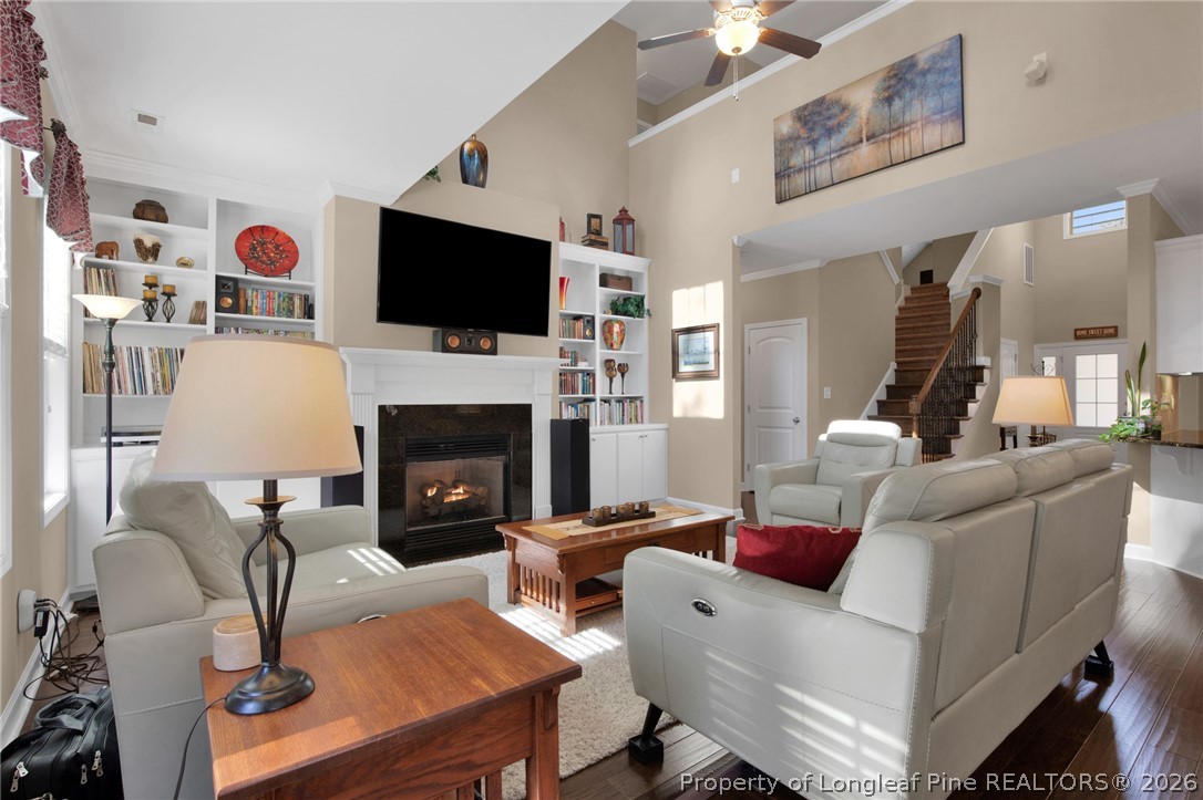 207 Pinetop Drive Carthage, NC 28327 - Photo 10 of 50 a living room with furniture a flat screen tv and a fireplace