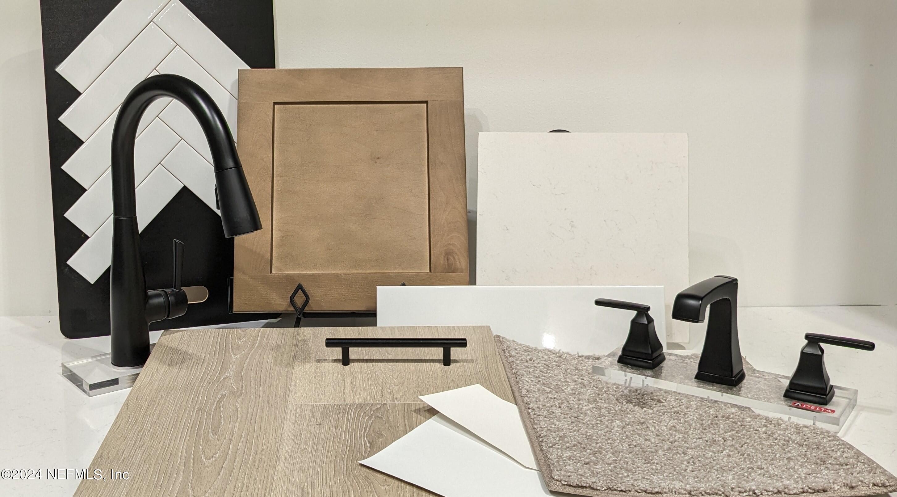 382 Cedar Elm Way St. Augustine, FL 32092 - Photo 2 of 25 a close view of a faucet a sink and a mirror