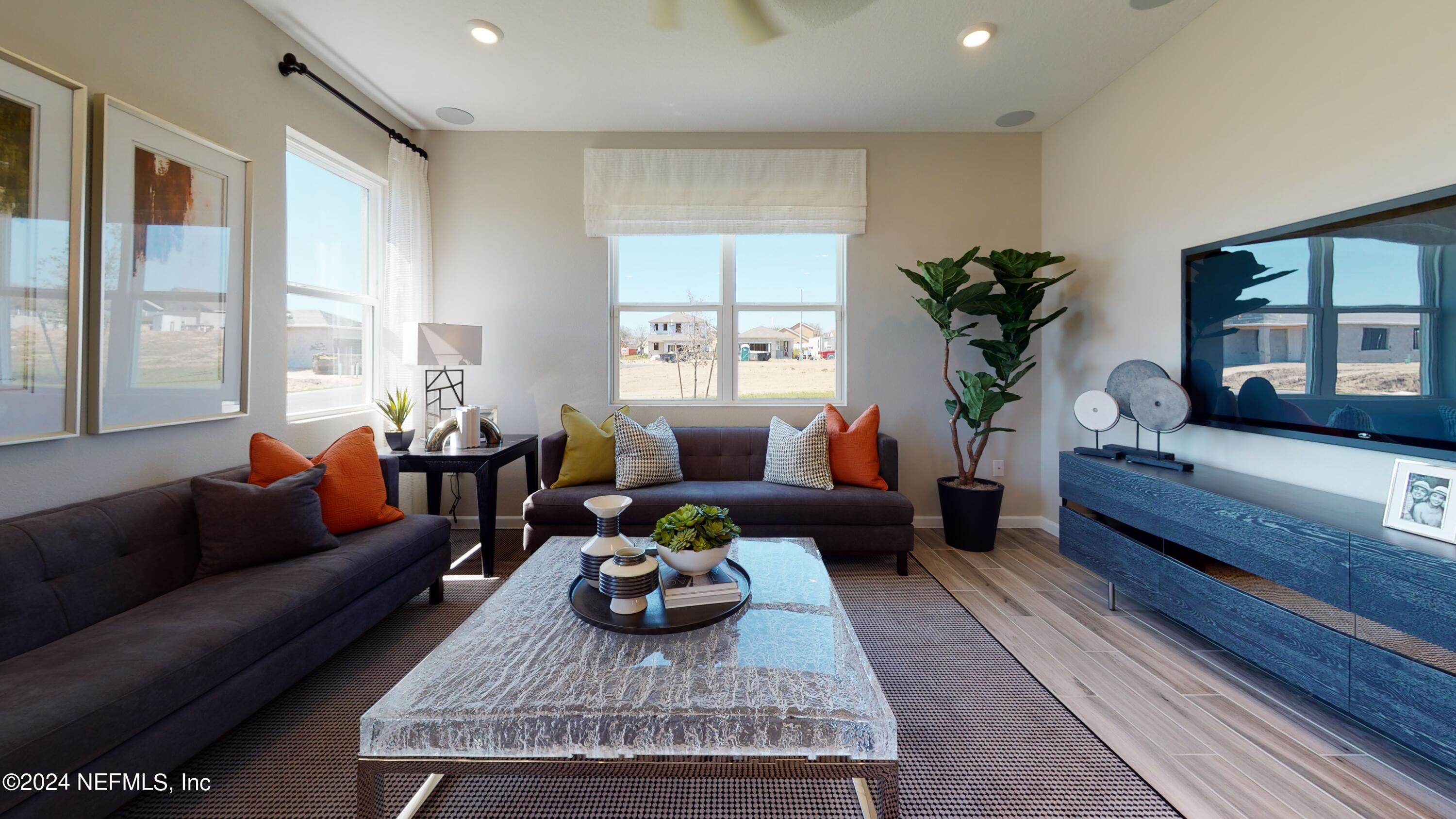 382 Cedar Elm Way St. Augustine, FL 32092 - Photo 10 of 25 a living room with furniture and a large window