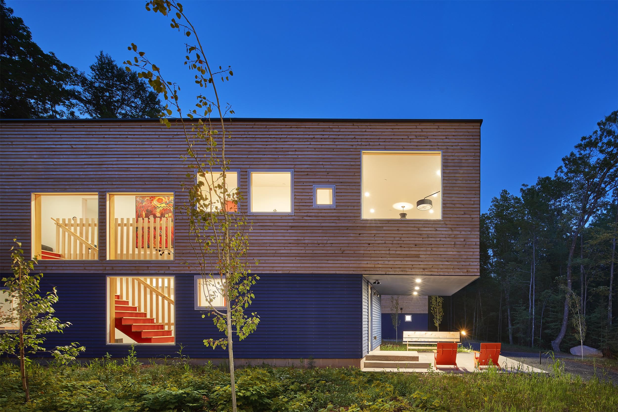 84860 Old San Road, Unit T4 Bayfield, WI 54814 - Photo 1 of 11 Back of house at twilight with a patio area