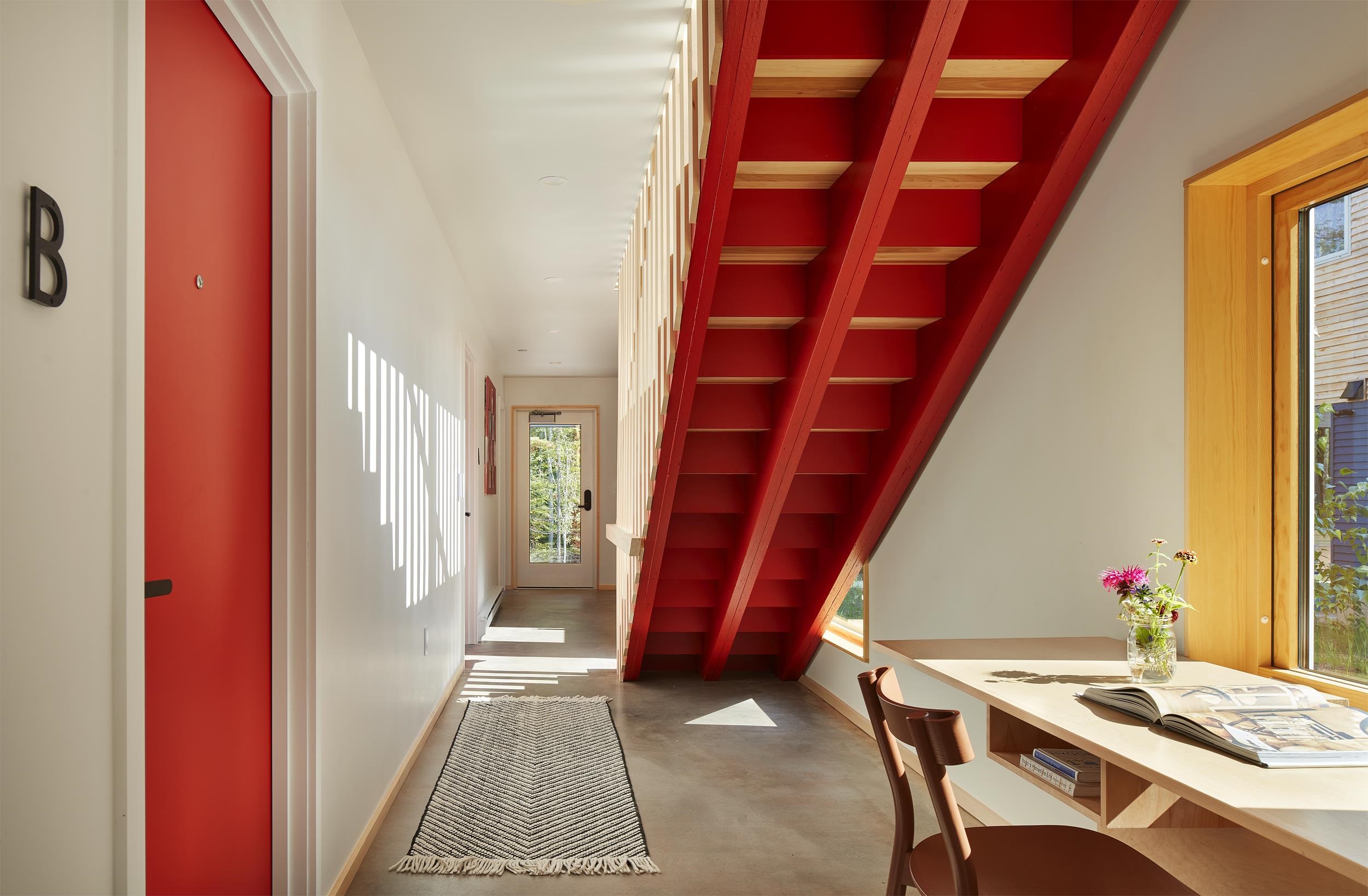 84860 Old San Road, Unit T4 Bayfield, WI 54814 - Photo 4 of 11 Corridor with baseboards and finished concrete floors