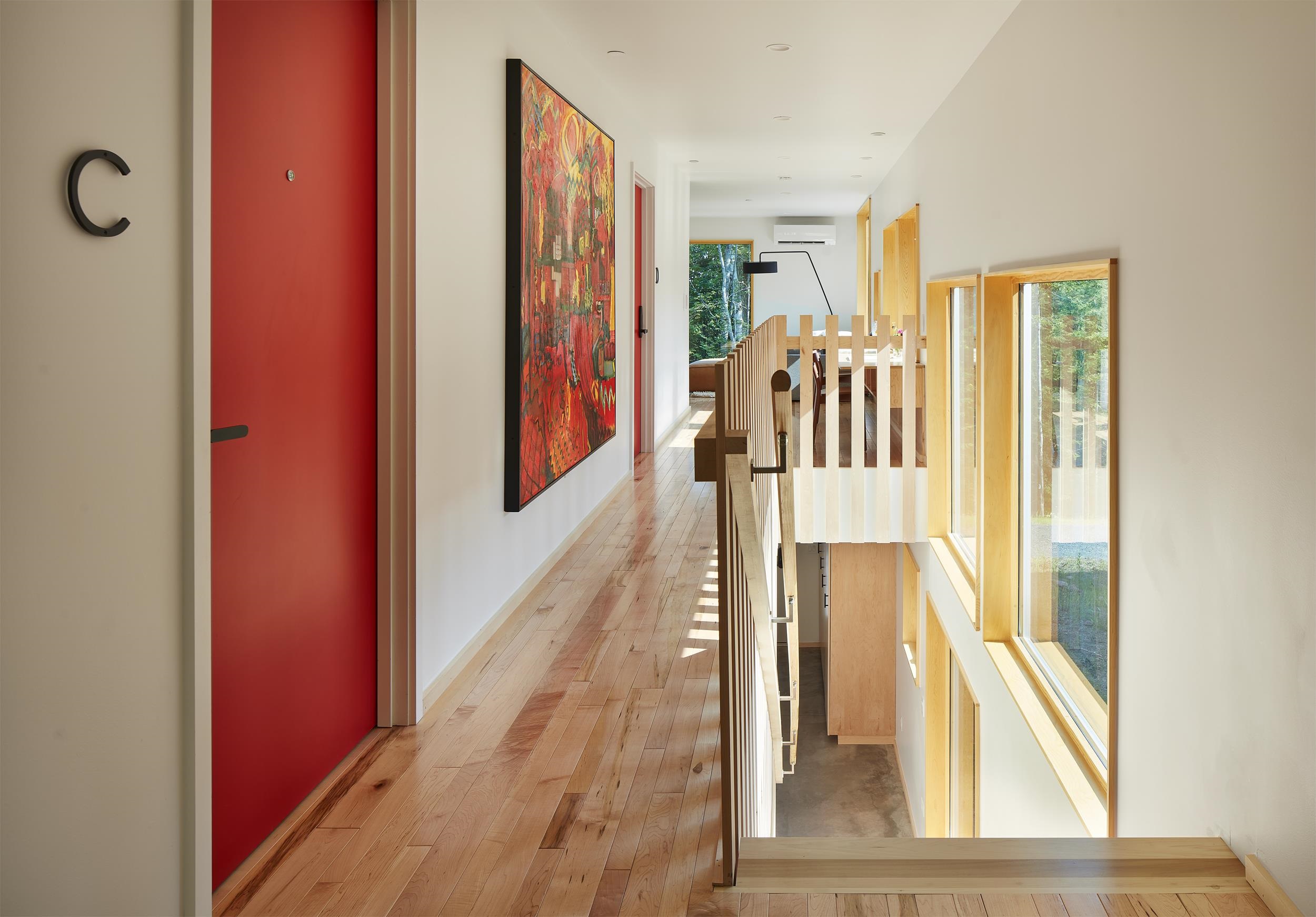 84860 Old San Road, Unit T4 Bayfield, WI 54814 - Photo 5 of 11 Hallway featuring an upstairs landing and light wood-style flooring