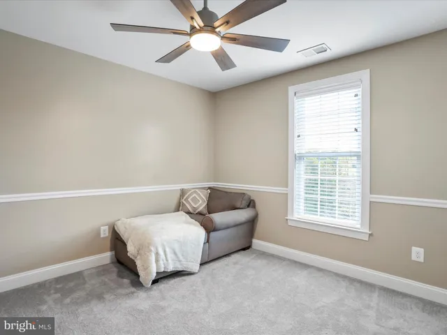 a bathroom with a sink a toilet and a window