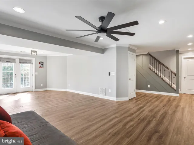 a view of balcony with wooden floor and fence