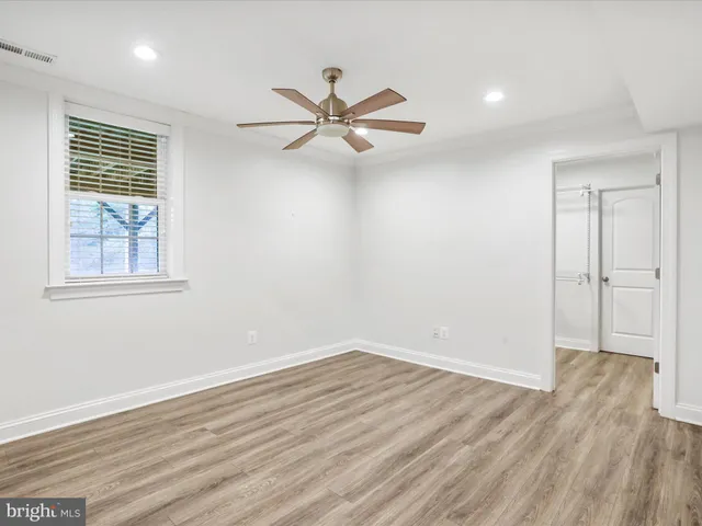 an aerial view of residential houses with outdoor space and river