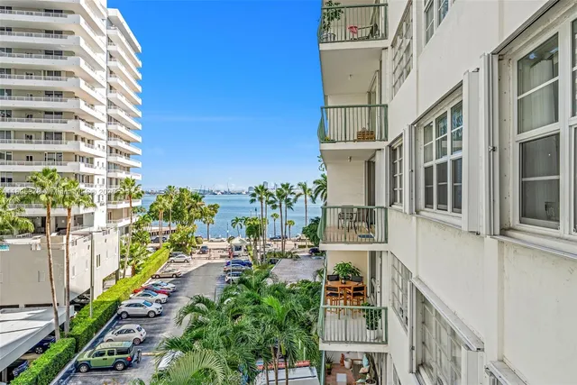 a view of a balcony with wooden floor