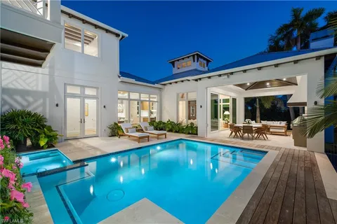 a view of swimming pool with outdoor seating