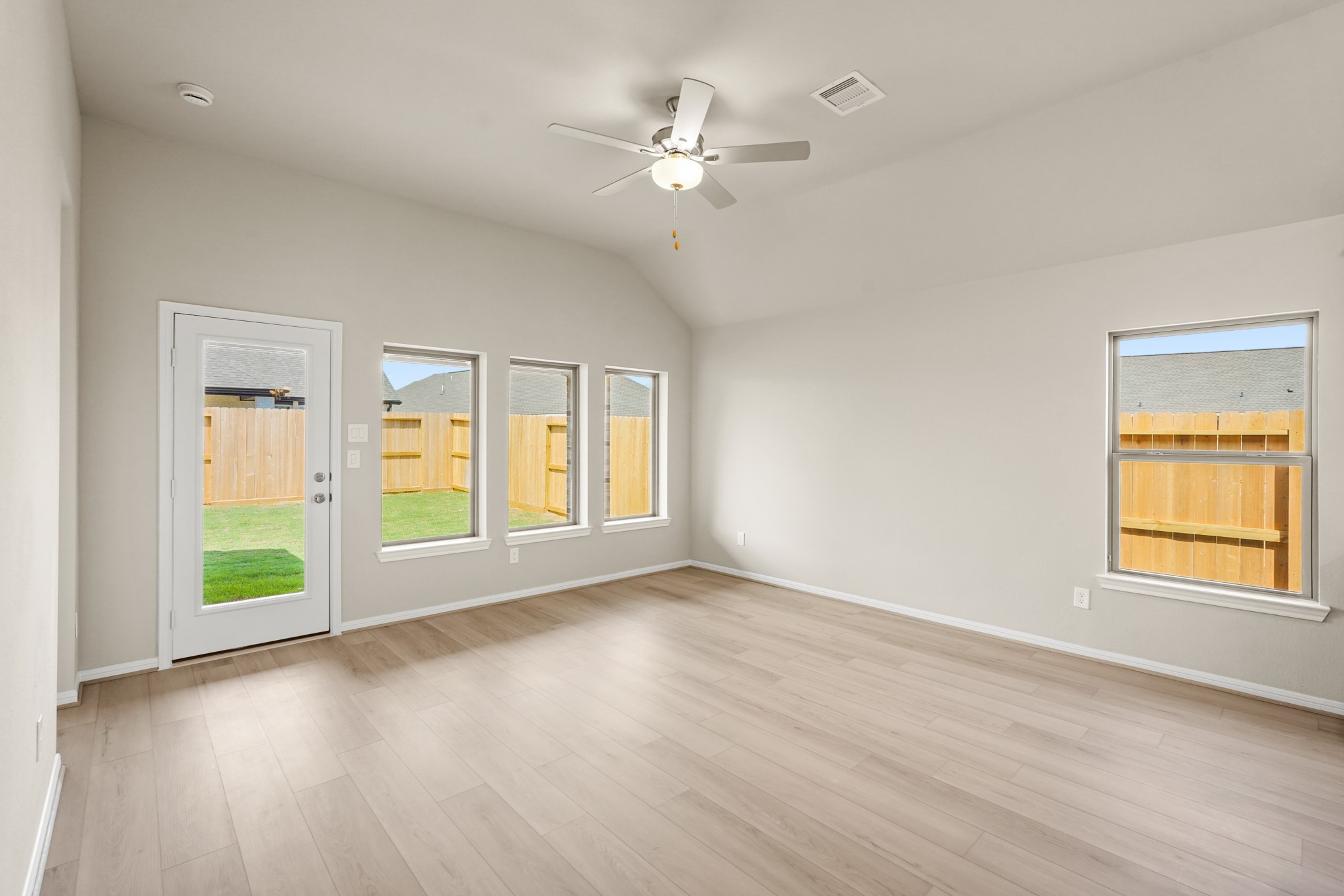 26530 Jolly Prairie Drive Hockley, TX 77447 - Photo 17 of 36 a view of an empty room with a window and wooden floor
