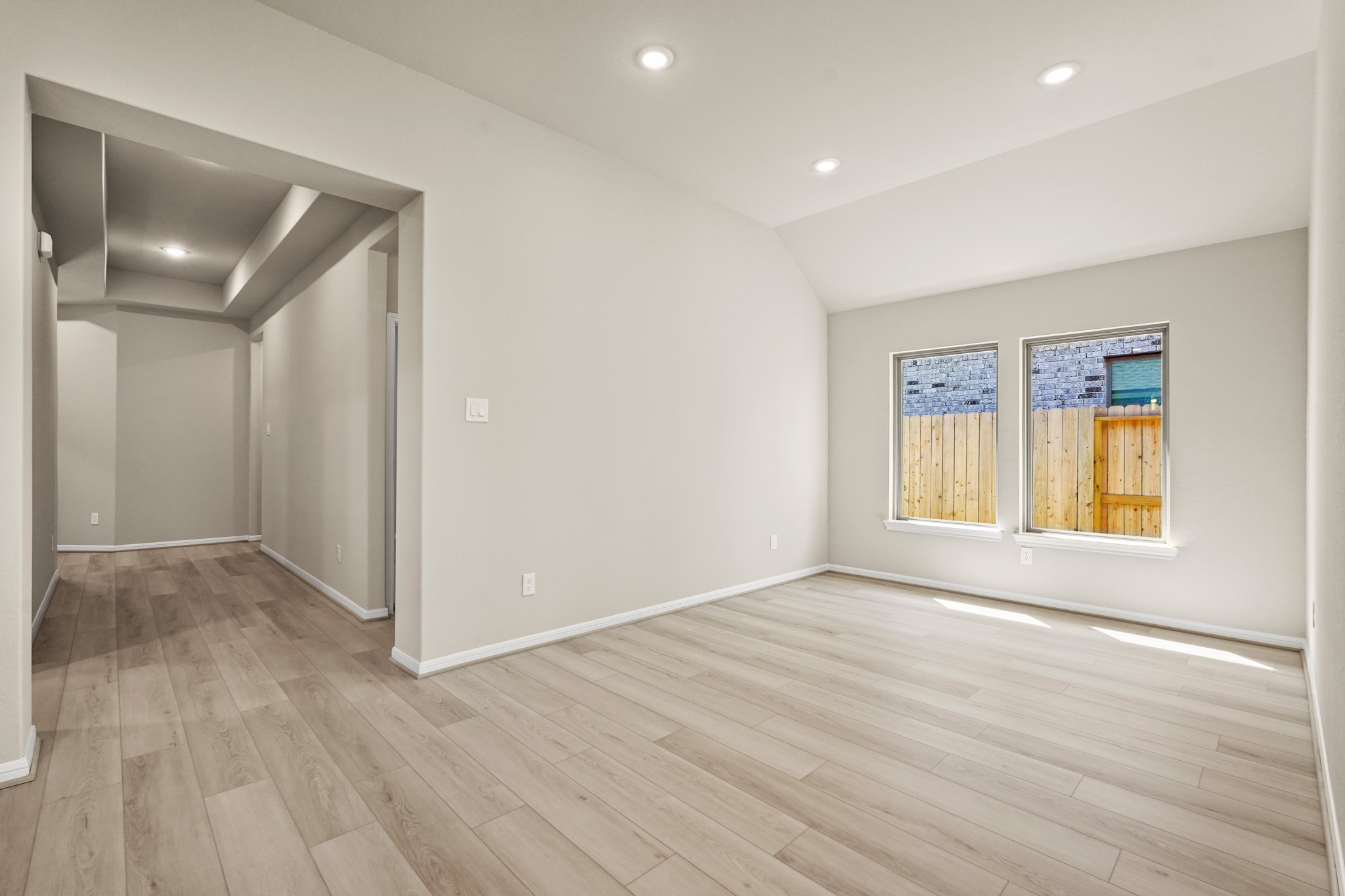 26530 Jolly Prairie Drive Hockley, TX 77447 - Photo 19 of 36 an empty room with wooden floor and windows