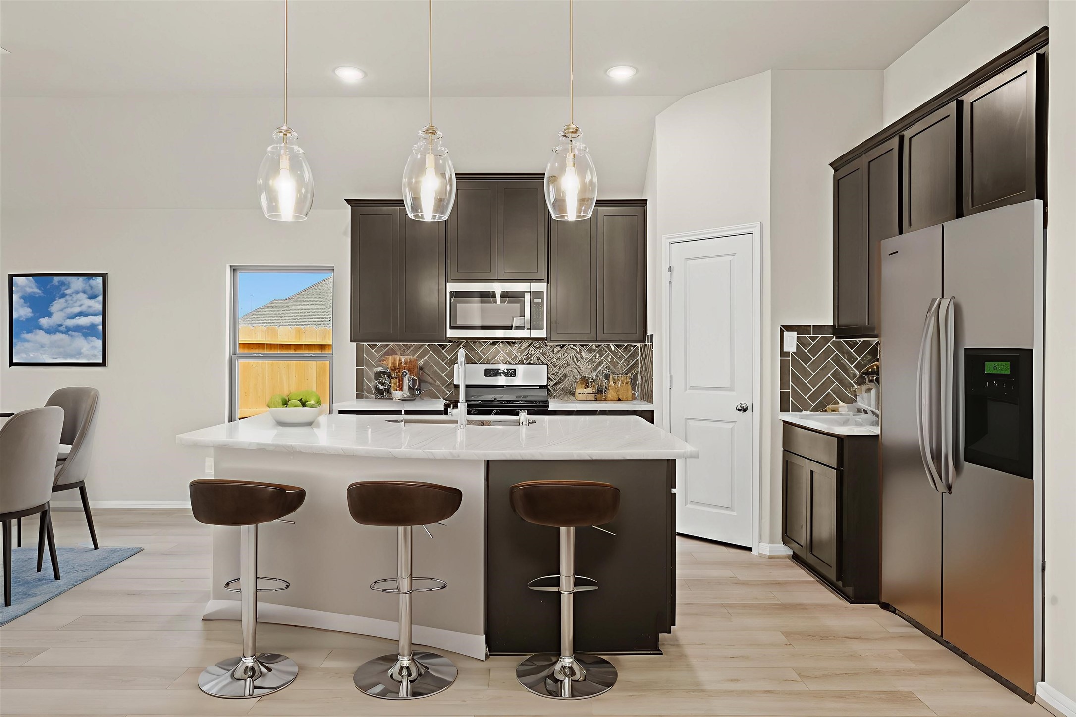26530 Jolly Prairie Drive Hockley, TX 77447 - Photo 2 of 36 a kitchen with refrigerator and chairs