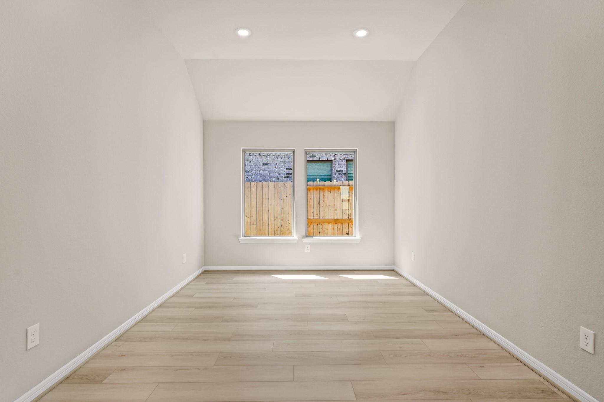 26530 Jolly Prairie Drive Hockley, TX 77447 - Photo 21 of 36 an empty room with wooden floor and windows