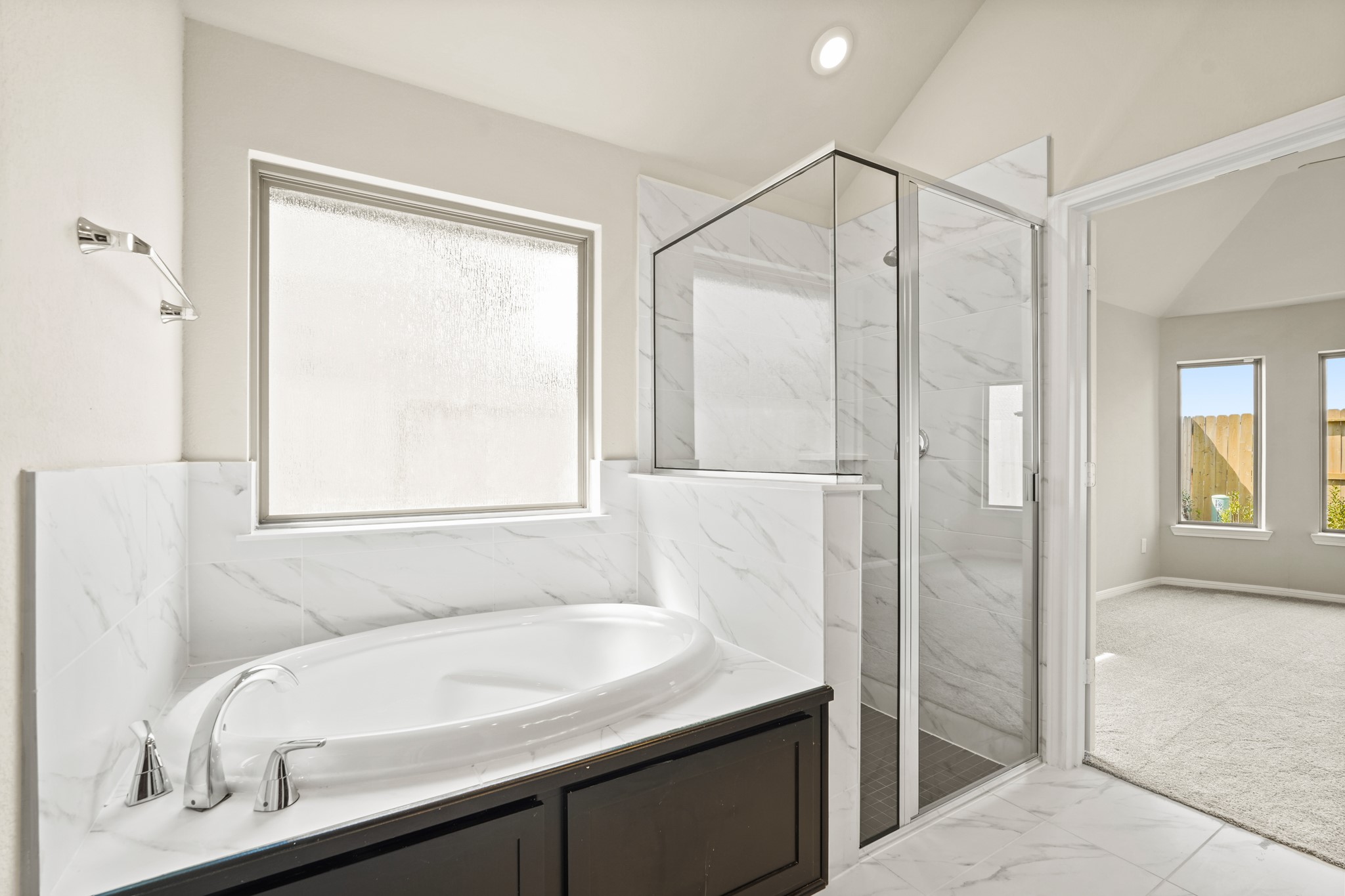 26530 Jolly Prairie Drive Hockley, TX 77447 - Photo 27 of 36 a bathroom with a granite countertop sink and a bathtub