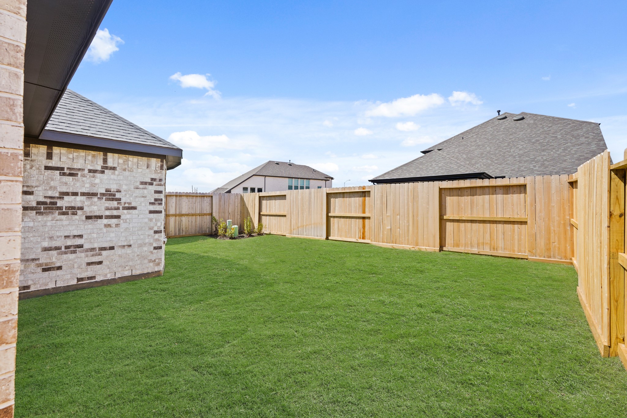 26530 Jolly Prairie Drive Hockley, TX 77447 - Photo 29 of 36 a view of a backyard with a garden and entertaining space
