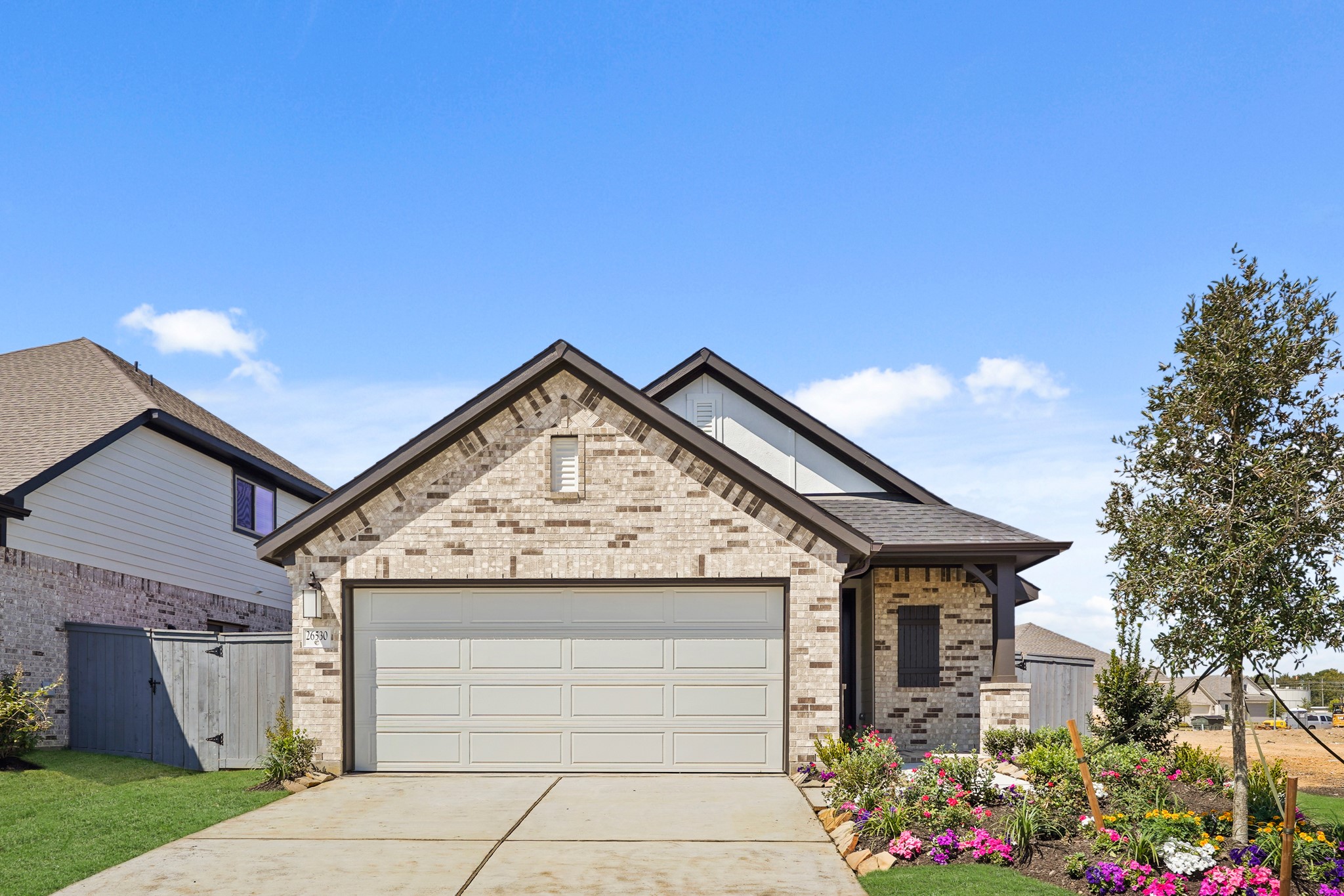 26530 Jolly Prairie Drive Hockley, TX 77447 - Photo 32 of 36 a front view of a house with a garden