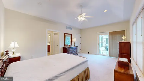 a bathroom with a bathtub and a window