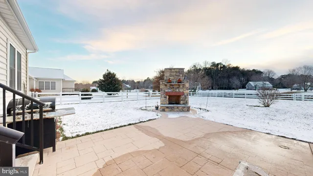 a view of a garden with sitting area