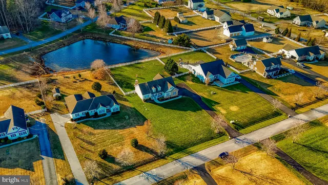 a front view of a house with outdoor seating