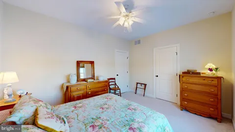 a view of bathroom with a sink and mirror
