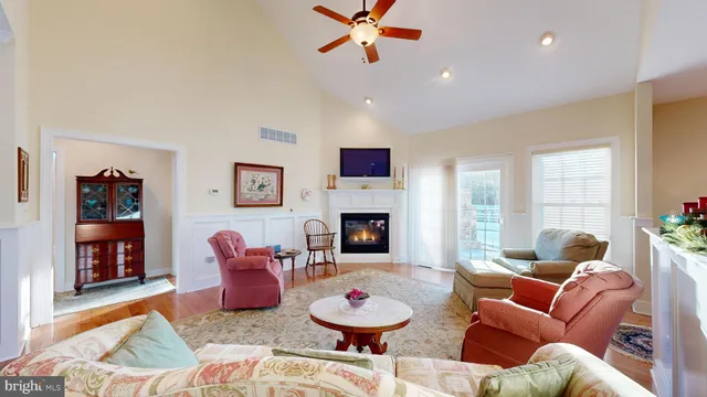 a view of a dining room with furniture and a kitchen