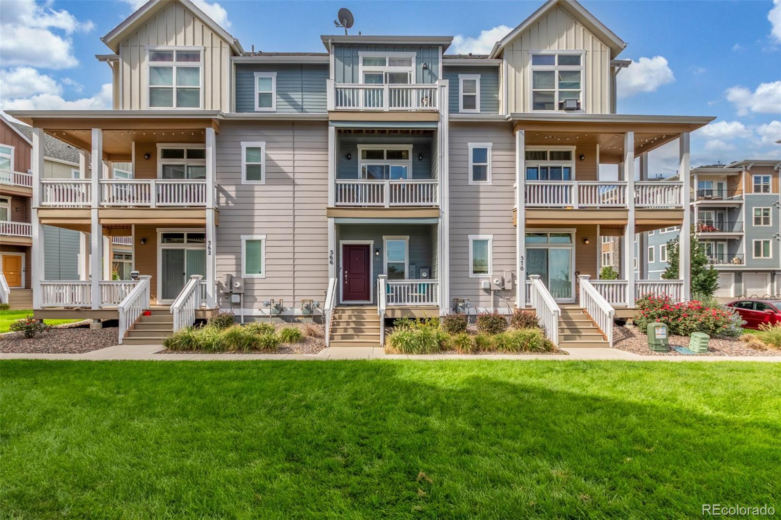 a front view of a house with a yard fire pit and outdoor seating