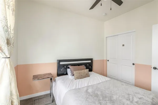 a bedroom with a bed and a table