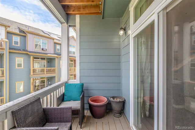 a view of a brick house with a fountain and a potted plant