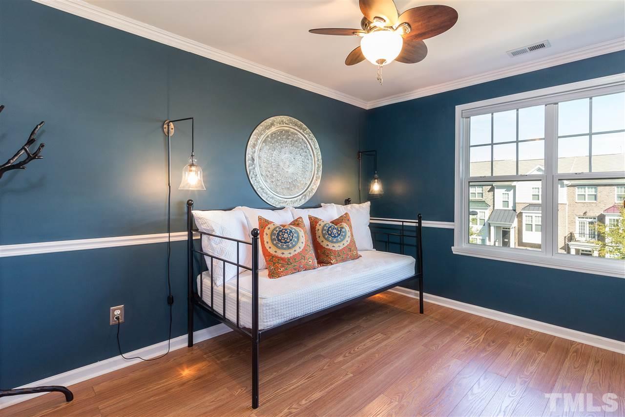 9135 Falkwood Road Raleigh, NC 27617 - Photo 22 of 25 This bedroom, with its rich jewel toned paint, also features a double window, ceiling fan and a walk-in closet.
