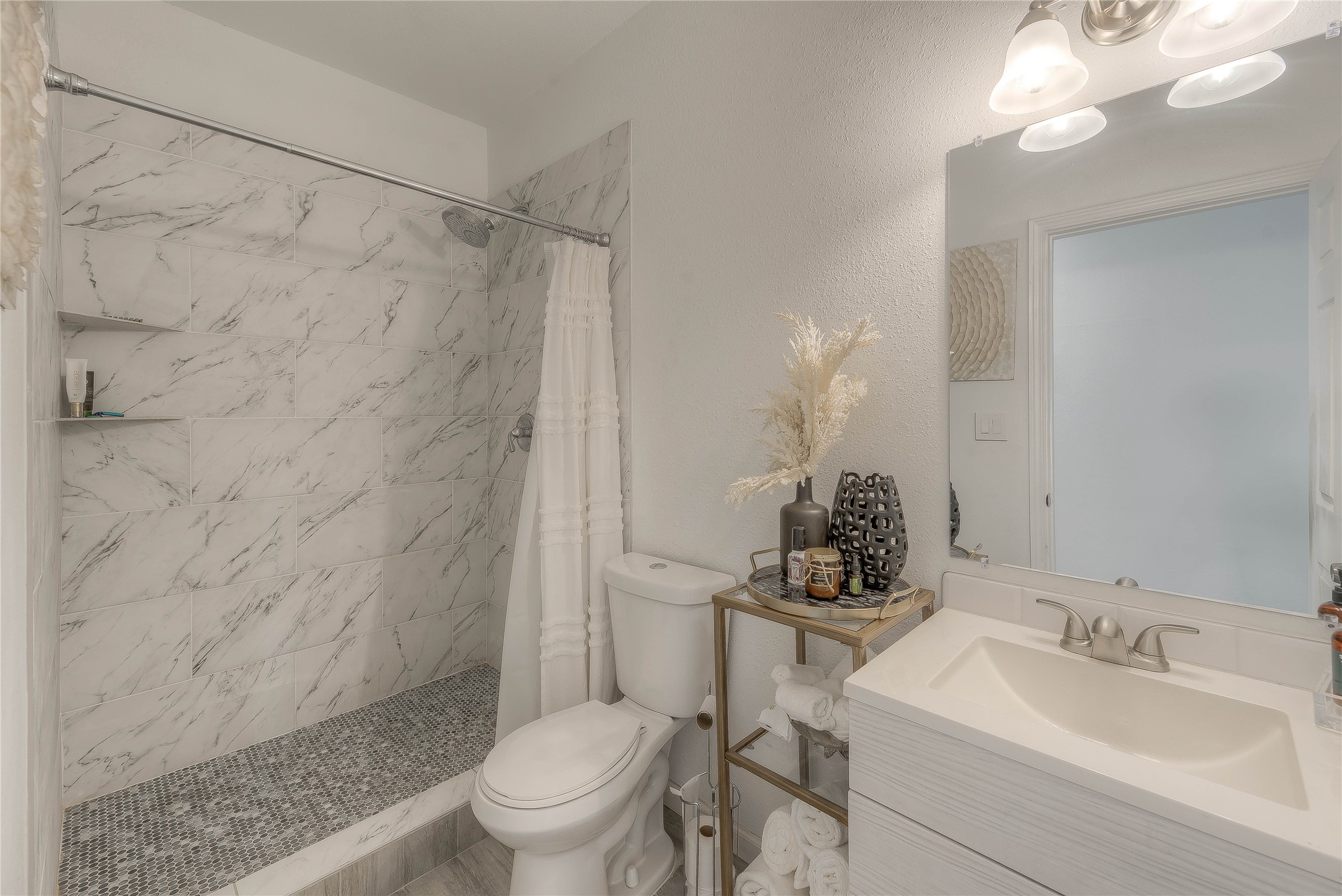 627 Pinewood Drive Trinity, TX 75862 - Photo 14 of 36 a bathroom with a sink toilet a mirror and shower