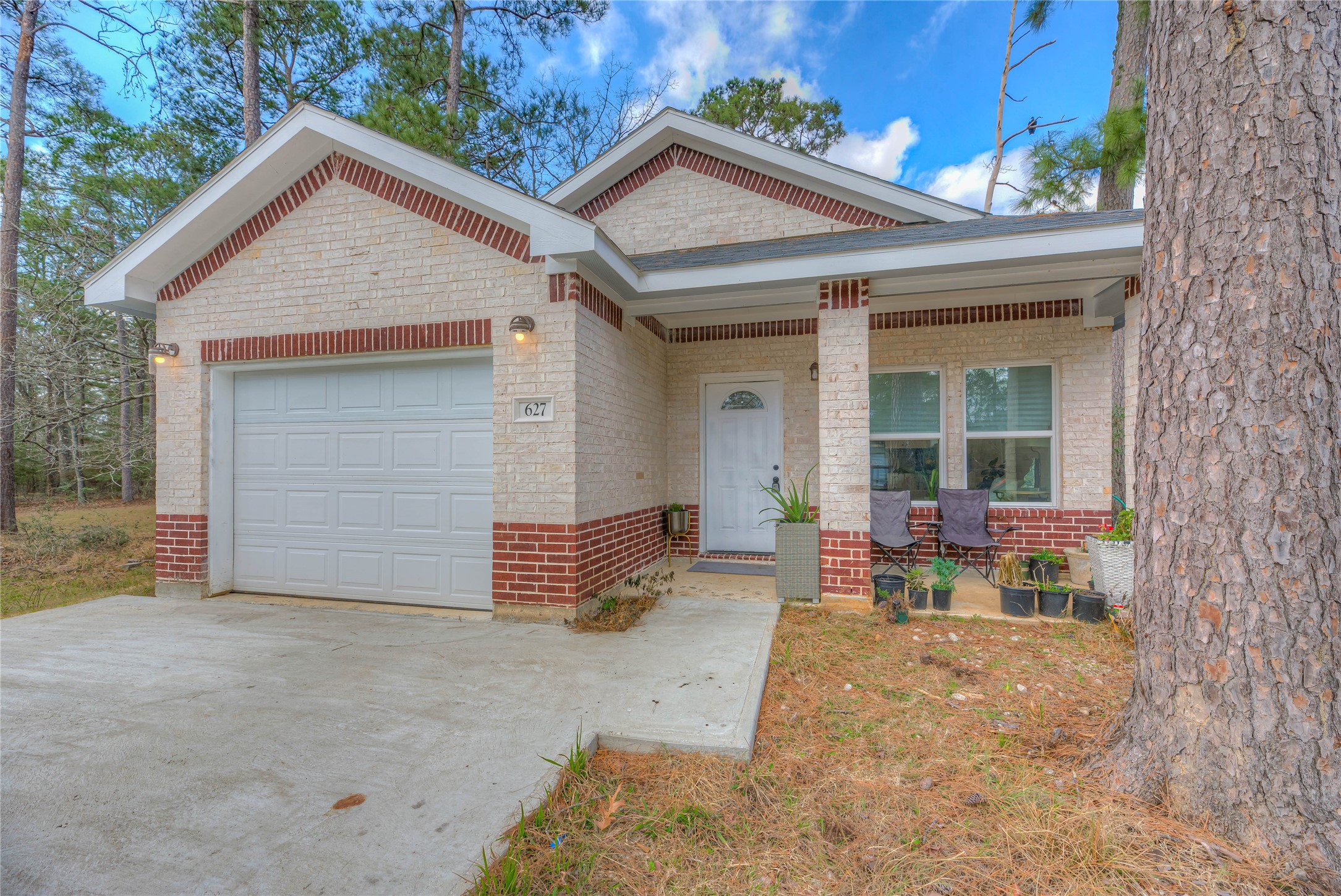 627 Pinewood Drive Trinity, TX 75862 - Photo 22 of 36 a front view of a house with patio
