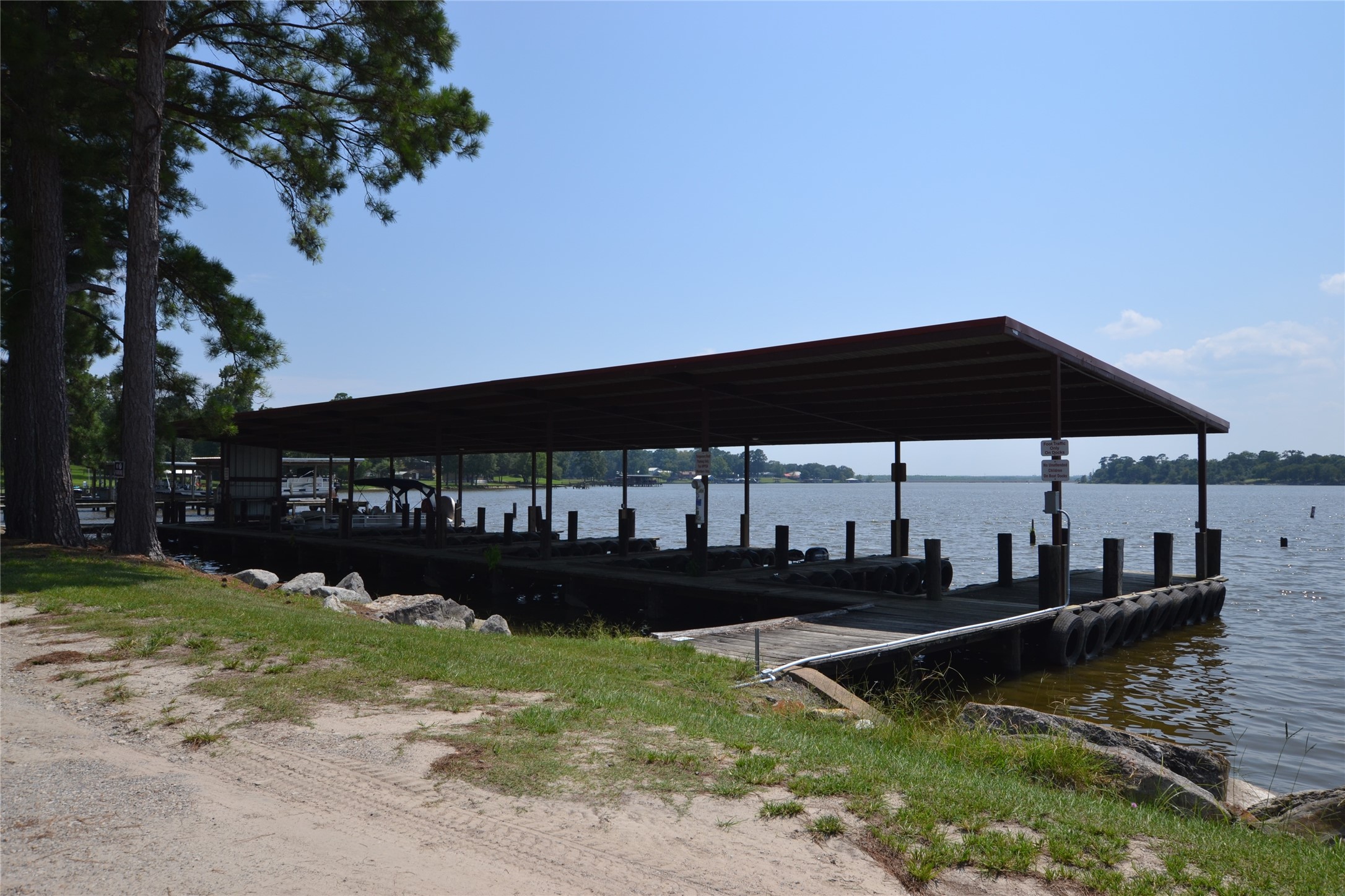 627 Pinewood Drive Trinity, TX 75862 - Photo 34 of 36 a view of swimming pool with seating space and trees