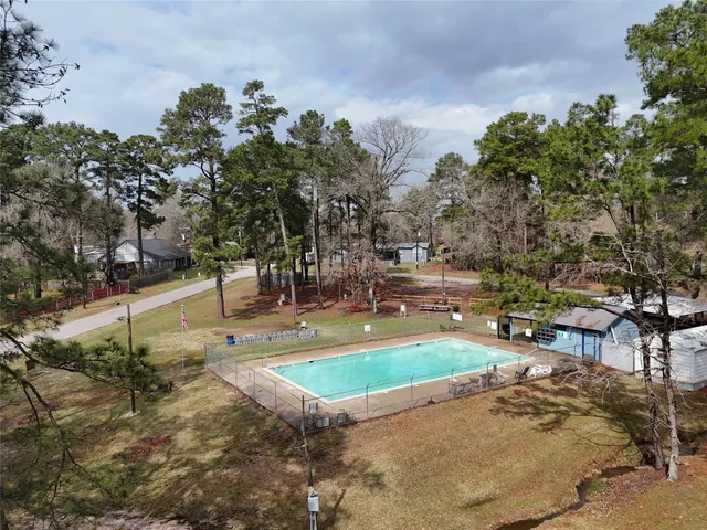 a view of a swimming pool with a patio