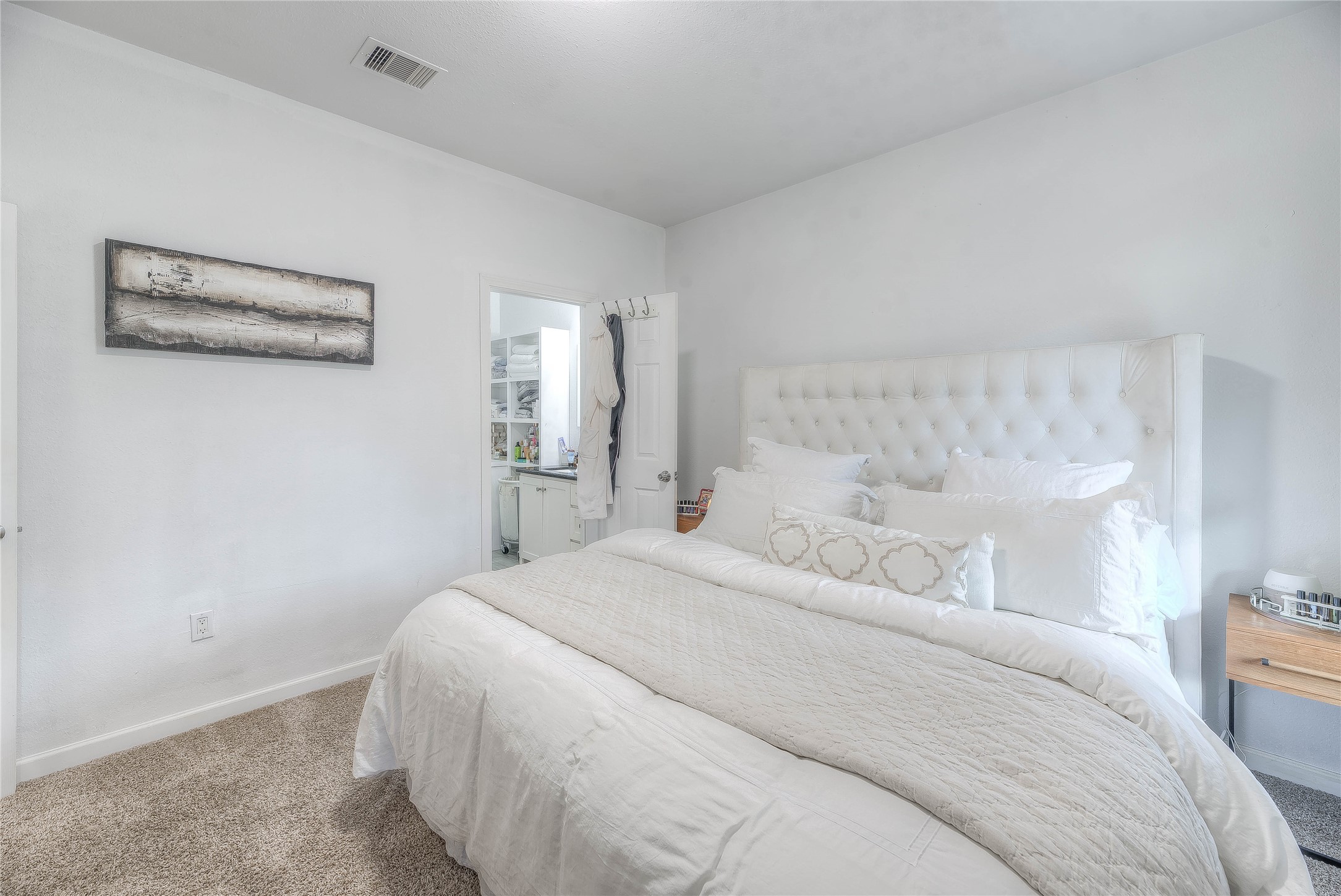 627 Pinewood Drive Trinity, TX 75862 - Photo 9 of 36 a bedroom with a bed and a night stand